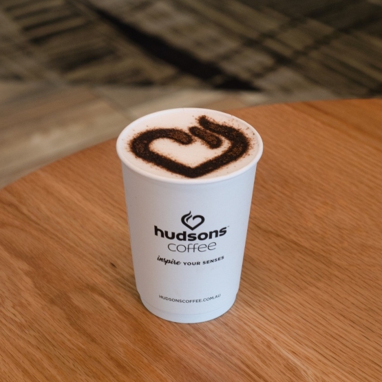 Cup of Hudsons’ coffee with foam art